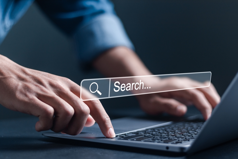 Searching the internet on a laptop.